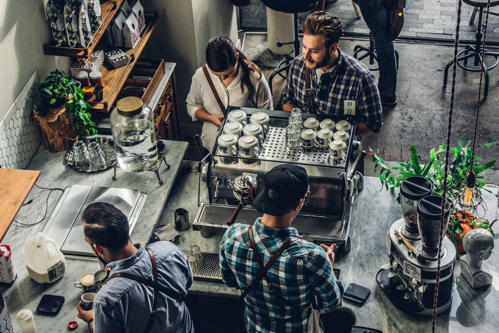 A customer ordering coffee at a café counter